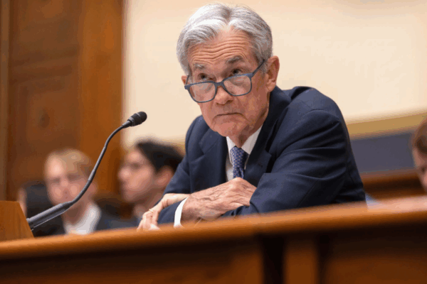 Powell signals no Fed rate cut for now, despite pressure from Trump to lower rates.